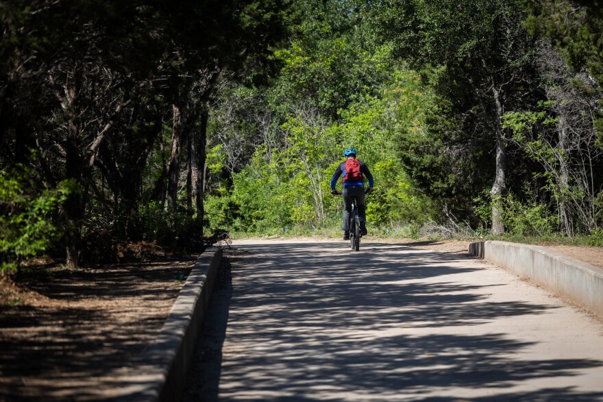 A bicyclist rides part of the Northern Walnut Creek Trail in Walnut Creek Metropolitan Park on April 12, 2023.