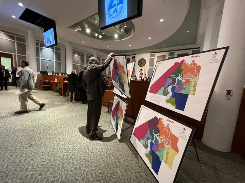 General Counsel Jason Teal sets up proposed maps at a redistricting meeting after a federal court ordered the Jacksonville City Council to redraw its district maps.