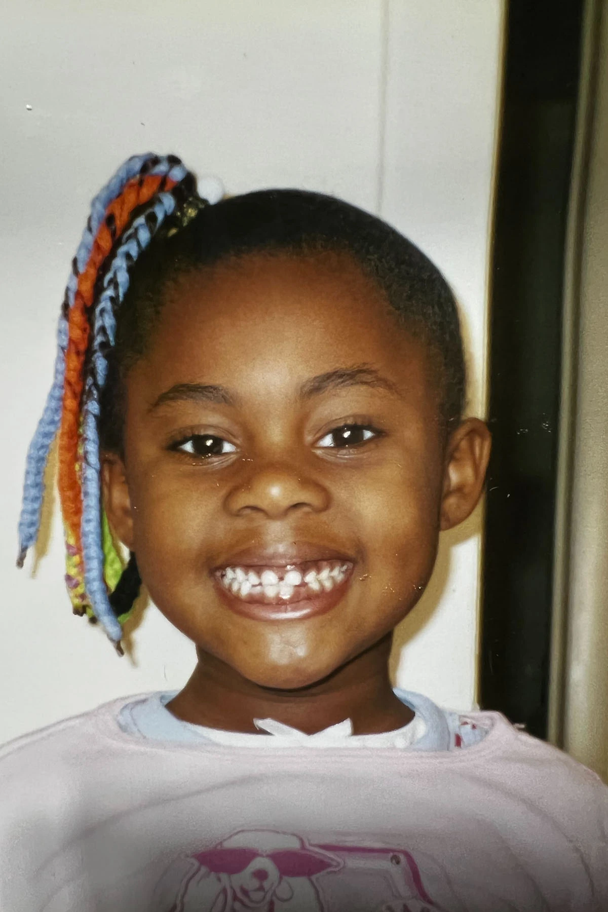 A 7-year-old Bria Hubert smiles as she shows off her hairstyle for "crazy hair day" at school.