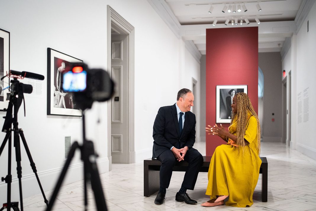 Doug Emhoff laughs as he speaks with 19th editor-at-large Errin Haines at the National Portrait Gallery in Washington, D.C.