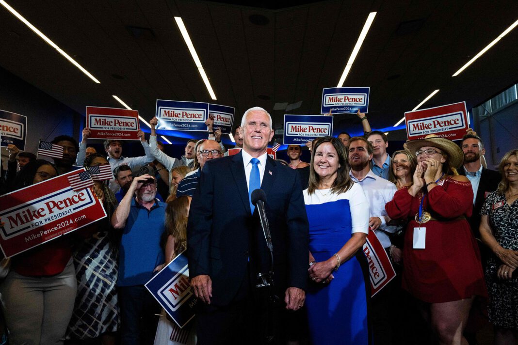 Mike and Karen Pence pose for pictures following Mike Pence