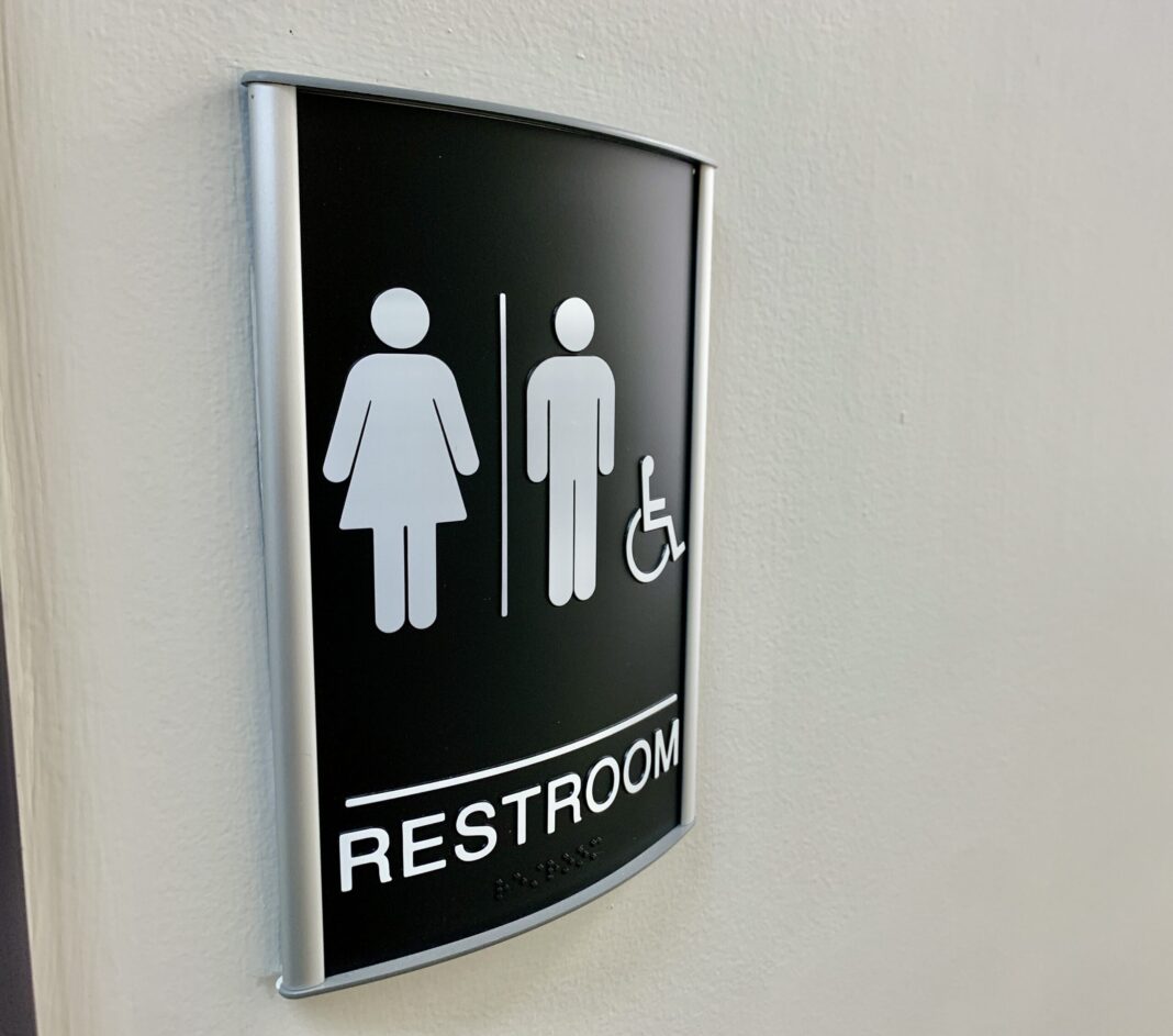At FL's community colleges, can students get in trouble if they use the wrong bathrooms?