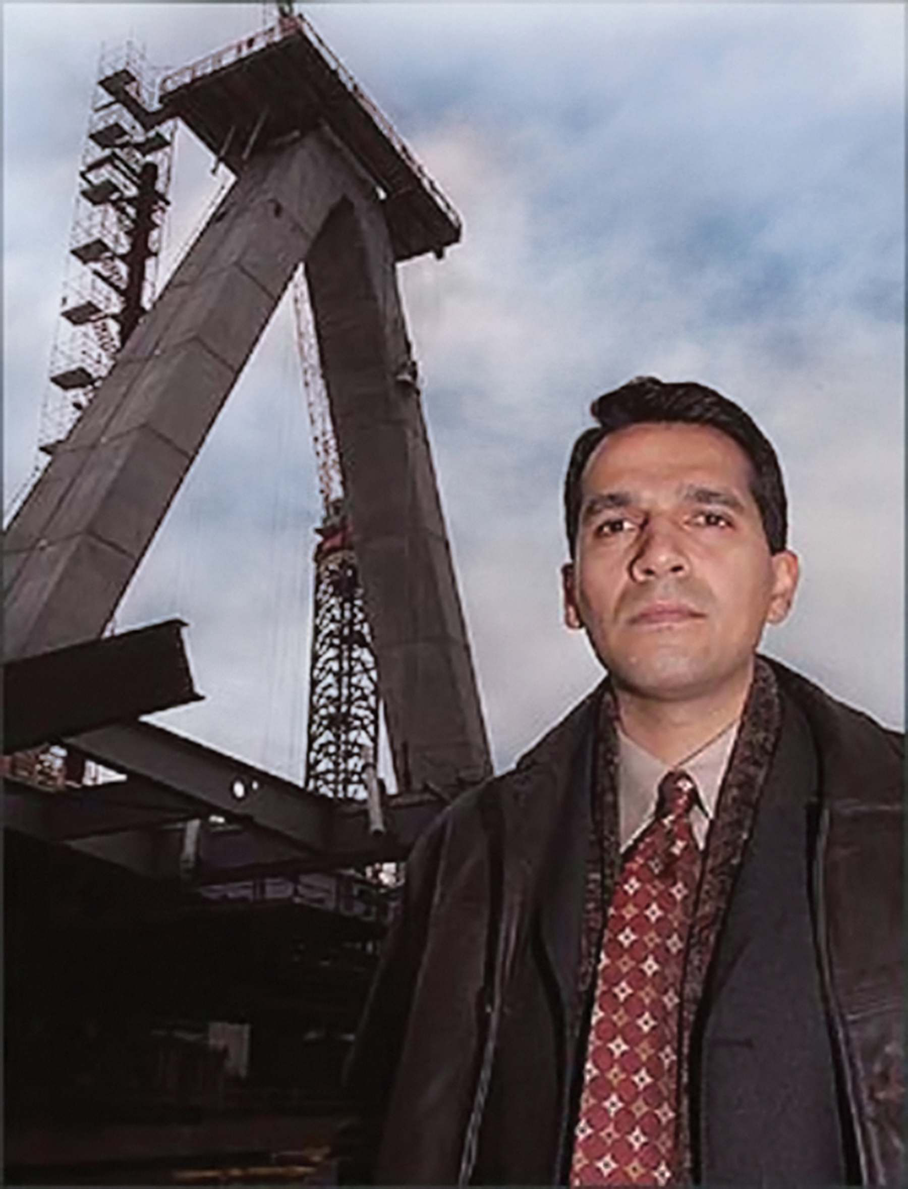 Miguel Rosales stands in front of a bridge construction site in the 1990s.