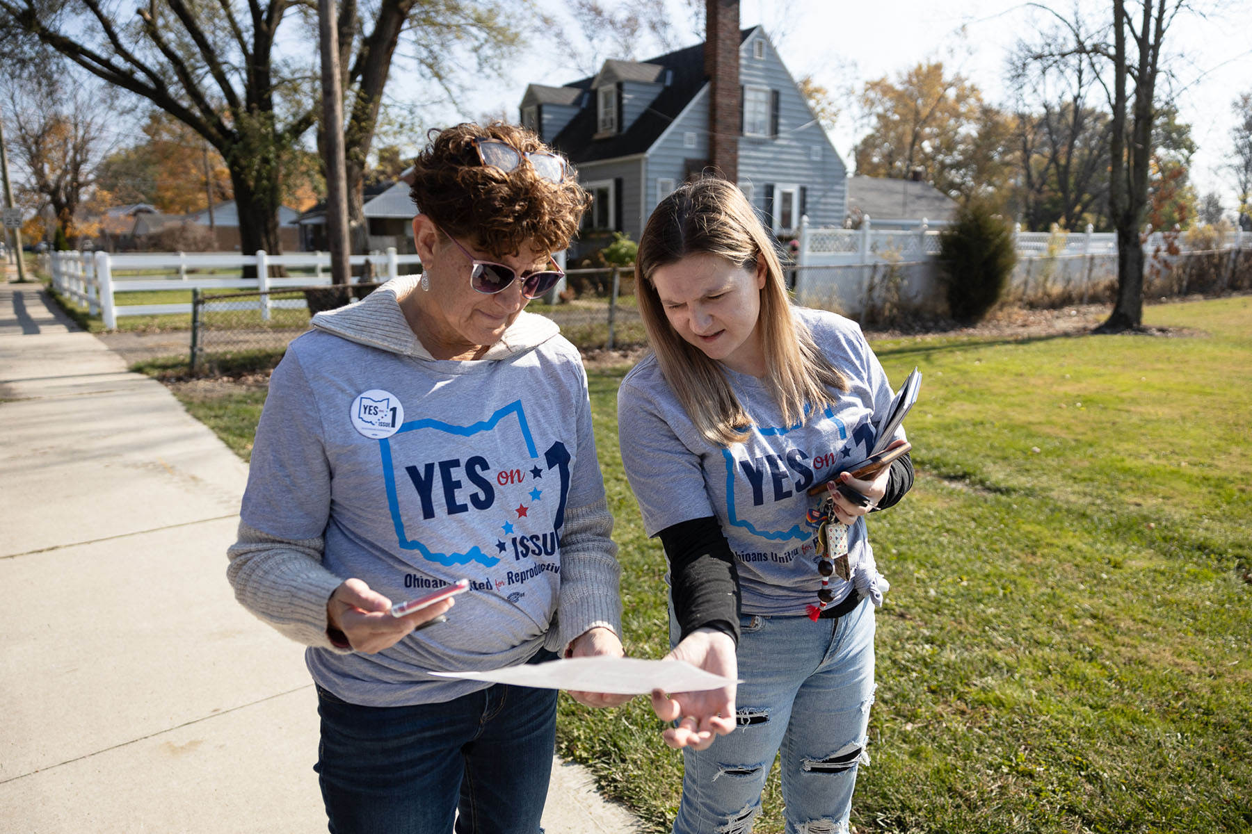 Abortion rights canvasser look at a map of a neighborhood before canvassing ahead of the general election.