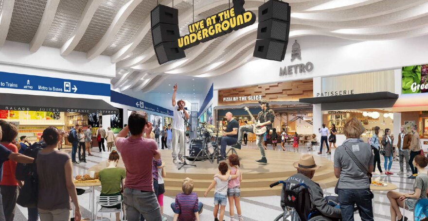  An illustration showing a fictitious band performing on a riser in an underground shopping mall with a pizza by the slice restaurant and French bakery in the background. 